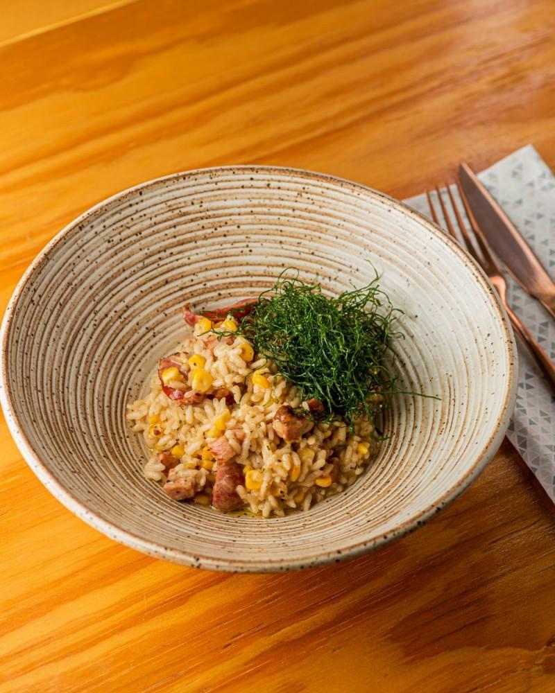 COUNTRYSIDE RISOTTO WITH THIN SAUSAGE, BACON, TOASTED CORN AND KALE